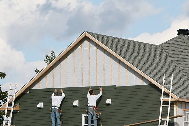 Professional Storm Damage Siding Repair technician working in Tracys Landing, MD